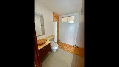 a bathroom with a sink and a toilet and a mirror at 2 Bedroom Beachfront Apartment 2P1-Al4 With Pool And WIFI in Cartagena de Indias