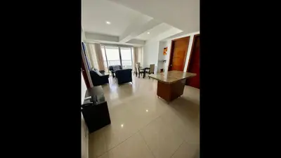a room with a desk and chairs in a building at 2 Bedroom Beachfront Apartment 2P1-Al2 With Pool And WIFI in Cartagena de Indias