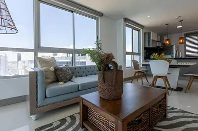 a living room with a couch and a table at Laurdhomes Palmetto Beach Floor 32, Sea View, 3HBT in Cartagena de Indias