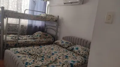 a bedroom with two bunk beds with a comforter at Apartamento Amoblado Cartagena in Cartagena de Indias