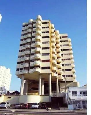 a tall building with cars parked in front of it at Apartamento con Vista al MAR 11 in Cartagena de Indias