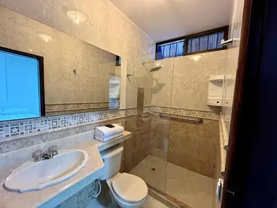 a bathroom with a sink and a toilet and a shower at Hotel Boutique Casa Pere in Cartagena de Indias