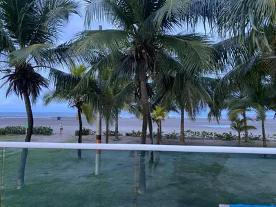 a view of a beach with palm trees and the ocean at DISFRUTE Y PLAYA in Cartagena de Indias