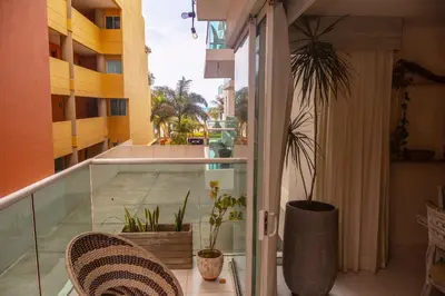 a balcony with chairs and plants on a building at Condominio frente al mar con acceso directo a la playa Morros 922 in Cartagena de Indias