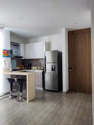 a kitchen with a stainless steel refrigerator and a counter at Apartamento morros con acceso directo a la playa in Cartagena de Indias