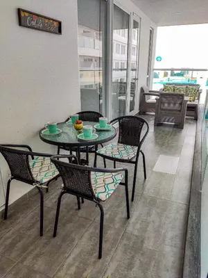 a table and chairs in a room with a table at Apartamento morros con acceso directo a la playa in Cartagena de Indias