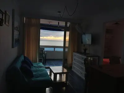 a living room with a couch and a view of the ocean at Apartamento con hermosa vista al mar en cartagena de indias in Cartagena de Indias