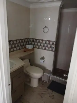 a small bathroom with a toilet and a sink at Apartamento con hermosa vista al mar en cartagena de indias in Cartagena de Indias