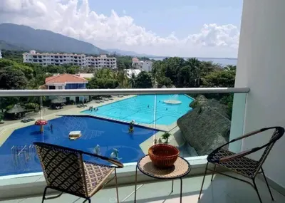 a balcony with a view of a swimming pool at * * Magnífico * * apto en la playa * *Costazul 405 in Santa Marta