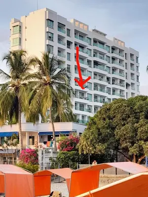 a large building with a red x in front of it at * * Magnífico * * apto en la playa * *Costazul 405 in Santa Marta