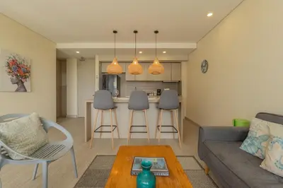 a living room with a couch and a table at MQ1003 | Jacuzzi privado · Relax en Cielo Mar in Cartagena de Indias