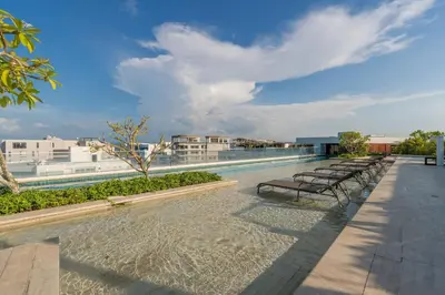 a row of benches on the roof of a building at MQ701 Nuevo Apto Boho Style Jacuzzi privado in Cartagena de Indias