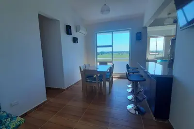 a kitchen and dining room with a table and chairs at Apto en Coveñas cerca al mar in Coveñas