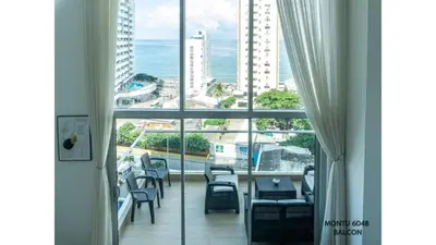 a room with a view of a city from a window at Espectacular Duplex con vista al mar in Cartagena de Indias