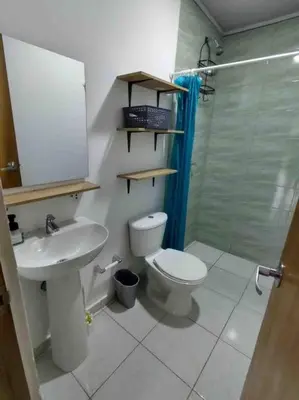 a bathroom with a toilet and a sink and a shower at San Antero Cabaña de Oro in San Antero
