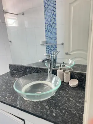 a bathroom counter with a sink and a mirror at Apartamento de 3 habitaciones, 1103 in Cartagena de Indias