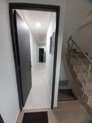 a hallway with a door leading to a stair case at Apartaestudio Cartagena 4P in Cartagena de Indias