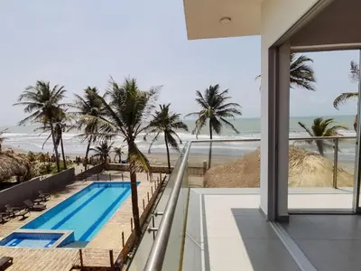 a view of the beach from the balcony of a house at Dúplex de lujo con vista al mar - San Bernardo del Viento in San Bernardo del Viento