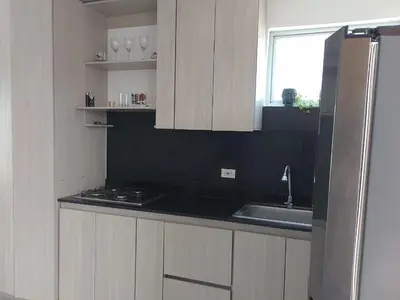 a kitchen with a sink and a counter top at Dúplex de lujo con vista al mar - San Bernardo del Viento in San Bernardo del Viento