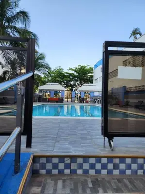 a view of a swimming pool in a building at Beachside Escape 2BR with Pool in Cartagena de Indias