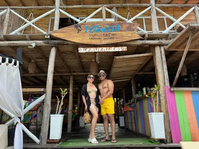 a man and a woman standing in front of a building at Tequila SunBeach Baru Eco-Hotel in Baru