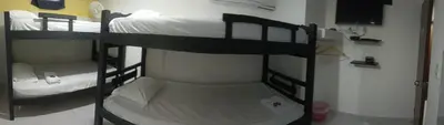 a room with two bunk beds in a room at HOSTAL EL ALTISIMO in Cartagena de Indias
