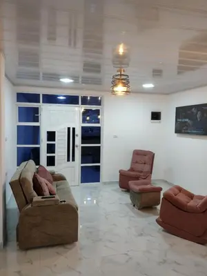 a living room with two couches and two chairs at Apartahotel Los Ángeles in Cartagena de Indias