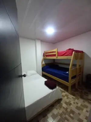 a small room with two bunk beds in it at Apartahotel Los Ángeles in Cartagena de Indias