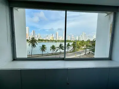 a window in an office with a view of a city at Apartamento en Laguito Ed. Cristoforo 303 ICDI in Cartagena de Indias