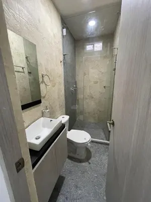 a bathroom with a sink and a toilet and a shower at Campiña Stay Apartamento Amoblado in Cartagena de Indias