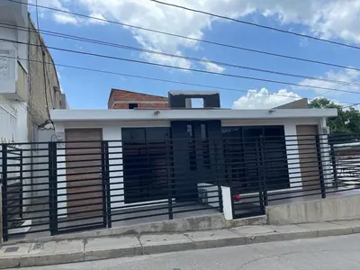 a small house with a black and white facade at Campiña Stay Apartamento Amoblado in Cartagena de Indias