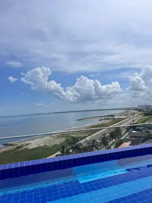 a view of the beach from a swimming pool at Confortable Apartamento Ocean Drive 711 -estancia mínima 2 noches- in Cartagena de Indias