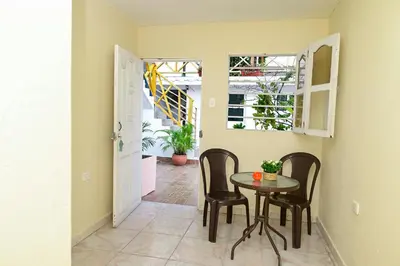 a dining room with a table and chairs in a room at Casa Hotel Terraza del Cabrero in Cartagena de Indias