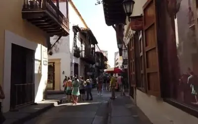 a group of people walking down a street at MoraRoom in Cartagena de Indias