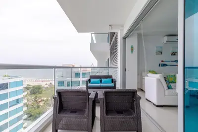 a living room with a table and chairs and a balcony at Espectacular apartamento en Cartagena Seaway935 - Morros in Cartagena de Indias