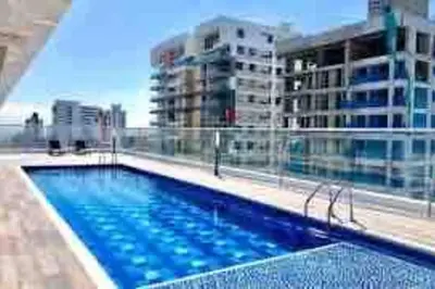 a large swimming pool on top of a building at Amazing views in Barranquilla in Barranquilla