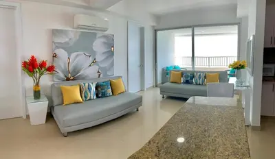 a living room with two couches and a couch at Apartment al-2 facing the sea with Wifi in Cartagena de Indias
