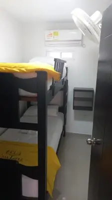 a room with two bunk beds in a small room at 3 bedroom apartment 3CL3 in the old center in Cartagena de Indias