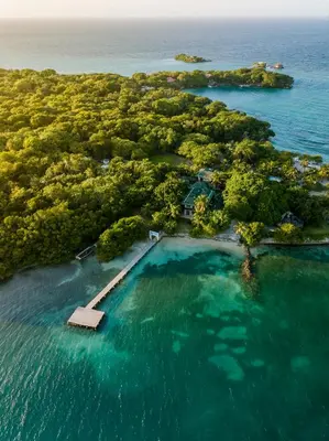 an island with a swimming pool in the water at Hotel Rosario de Mar by Tequendama in Isla Grande