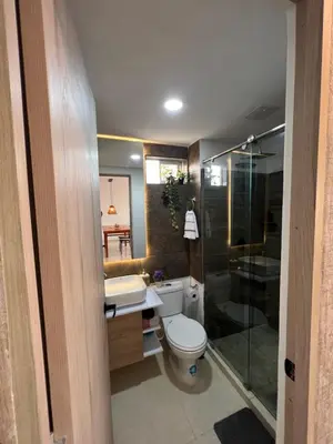 a bathroom with a toilet and a shower and a sink at Boho style house in Cartagena de Indias