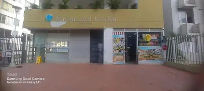 a building with two doors and a sign on it at Apartamento Amoblado Cartagena in Cartagena de Indias