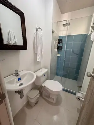 a bathroom with a sink and a toilet and a shower at Apartamento Amoblado Cartagena in Cartagena de Indias