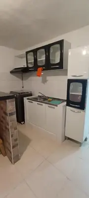 a kitchen with two windows and a counter top at Encantadora casa con ambiente guajiro #3 in Barranquilla