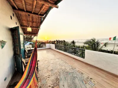 a balcony with a view of the beach at Eco-Hotel Chevere Beach in Puebloviejo