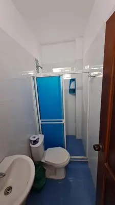 a bathroom with a toilet and a sink at Don Mathias # 2, Coveñas - Apartamento in Coveñas