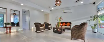 a living room with chairs and a wood stove at Extraordinaria Casa Finca Piscina AA in Sabanalarga