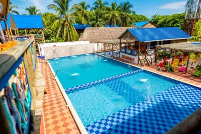 an overhead view of a swimming pool at a resort at Hotel Isla Lizamar in Isla Grande
