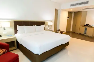 a large white bed in a hotel room at Hilton Garden Inn Barranquilla in Barranquilla
