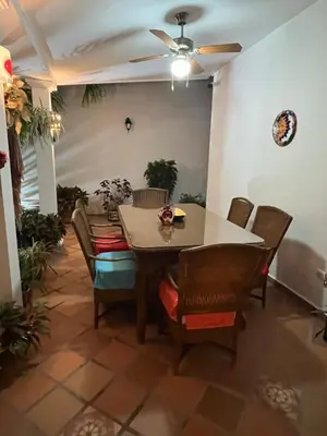 a dining room with a table and chairs at Casa Blanca María Barranquilla - Authentic republican house in Barranquilla