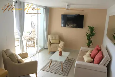 a living room with two couches and a table at 2BR Oceanfront Apartment - Direct Beach Access - Modern and Spacious - 6th Floor in Cartagena de Indias